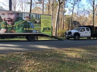 ECM Landscaping and Lawn Care's large commercial work vehicles.