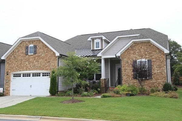 Healthy lawn and landscape in front of a home.