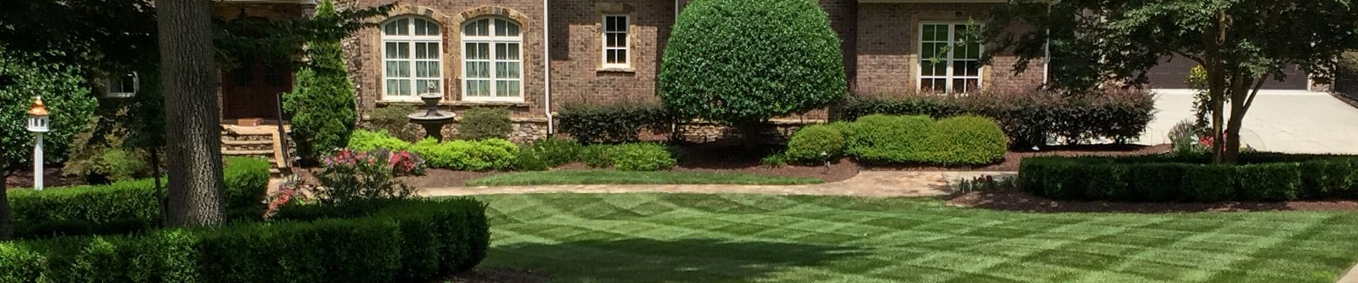 Beautiful lawn and landscape maintained by ECM Landscaping and Lawn Care in North Raleigh.