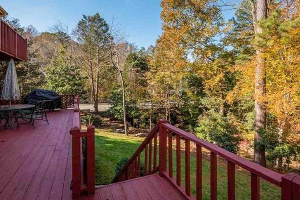 Deck view overlooking the back yard and woods beyond.